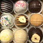 A mix of dark chocolate, milk chocolate, and white chocolate cake truffles in a variety of flavors.