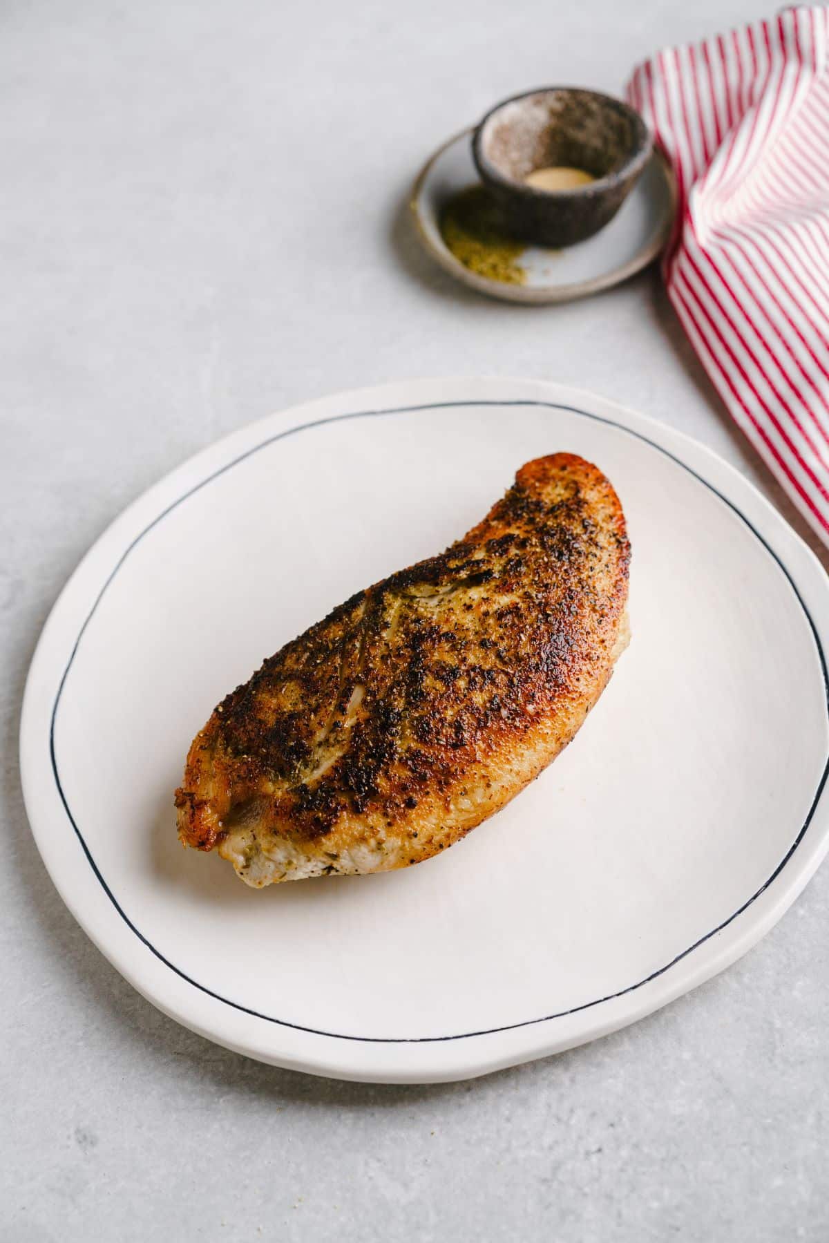 Cooked garlic chicken on a plate.