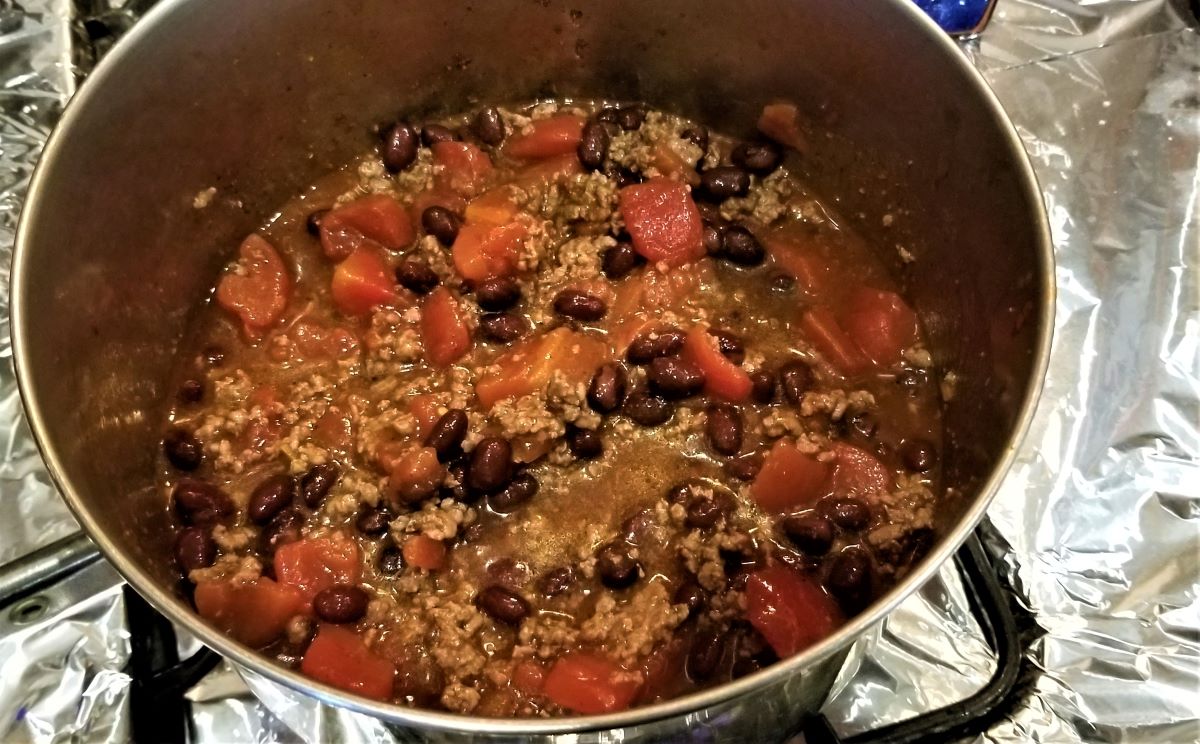 Chili ingredients mixed together in a pot.