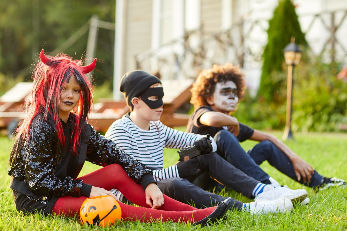 Kids in a field in Halloween Costumes