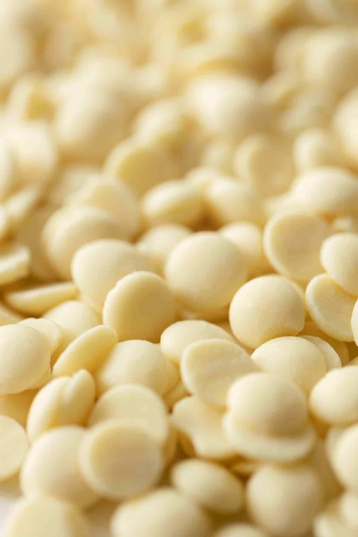 A close up of white chocolate chips.