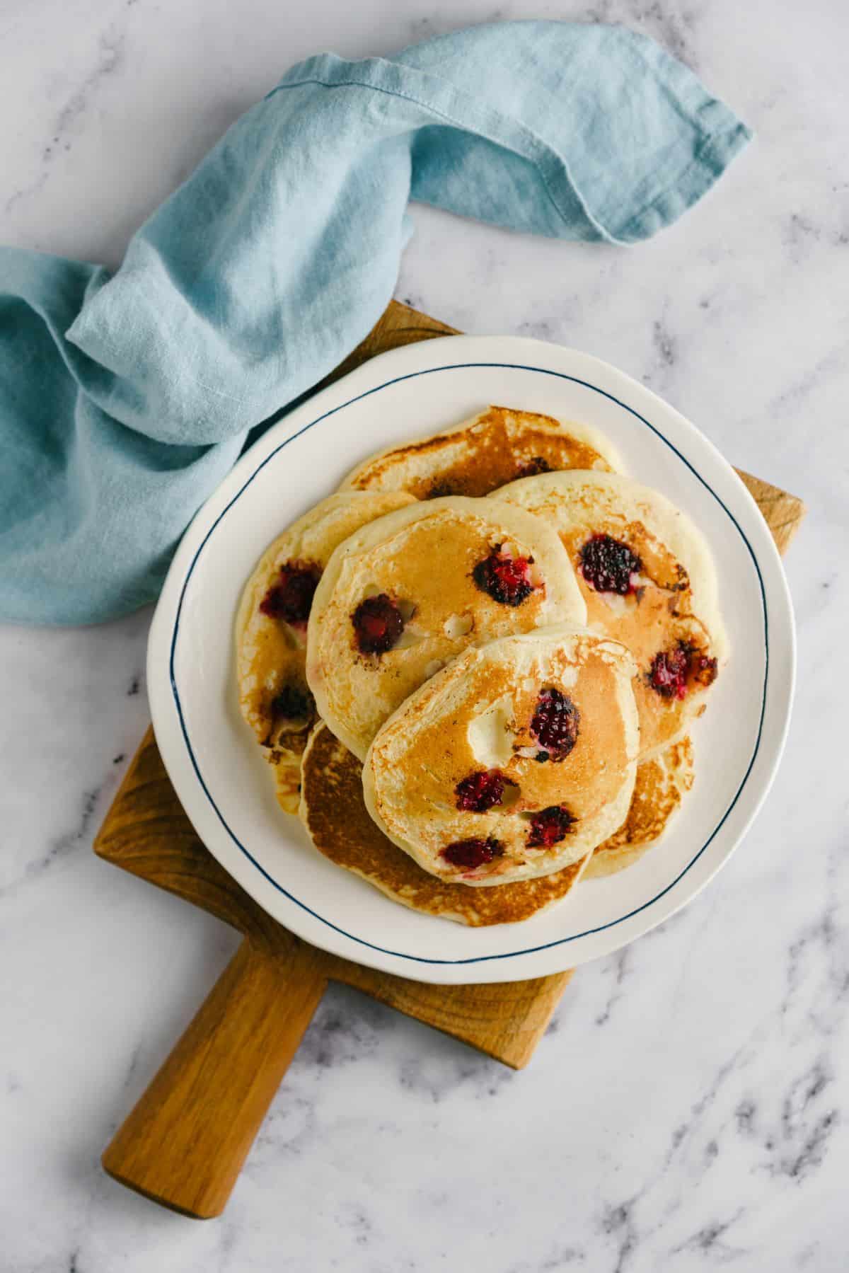 cooked pancakes studded with berries.