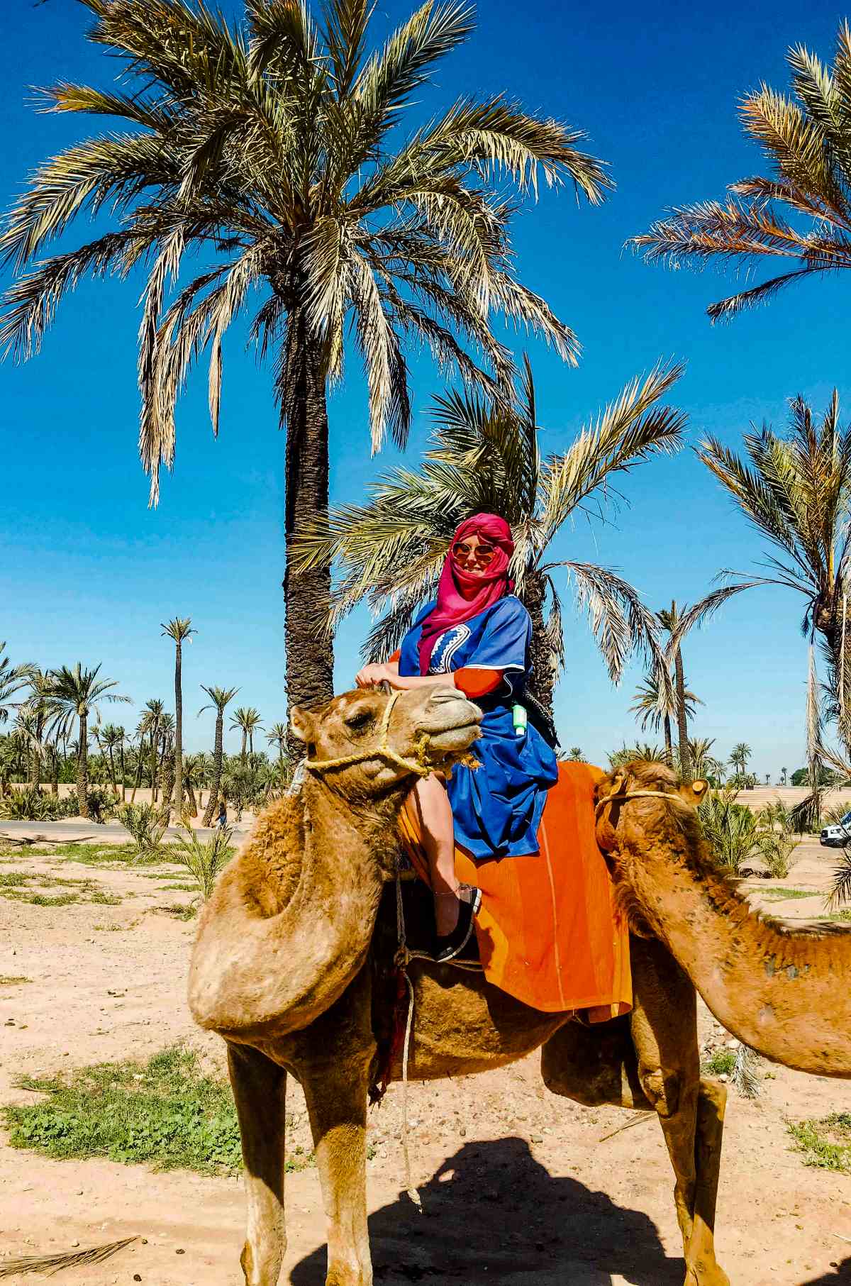 A woman riding a camel in Marrakech.