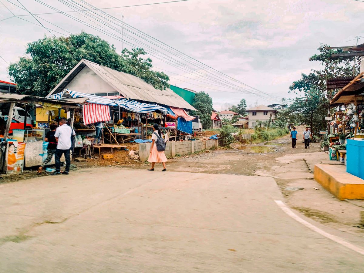 A tourist spot street with few people in Puerta Princesa.