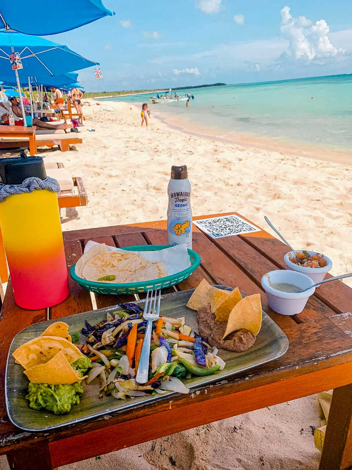 Food on a table on the Playa Palancar Beach.