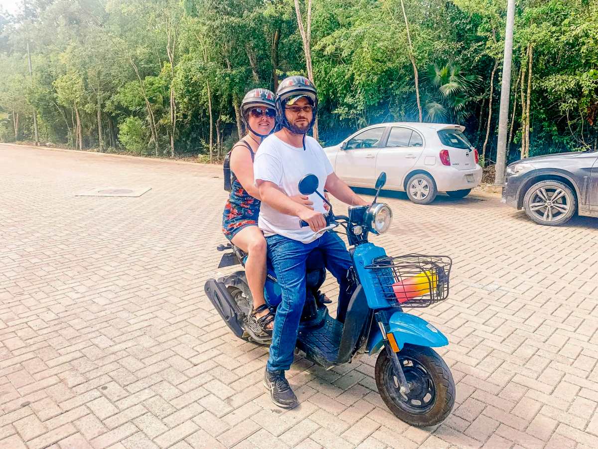 The blog author and husband on a bike in Tulum.